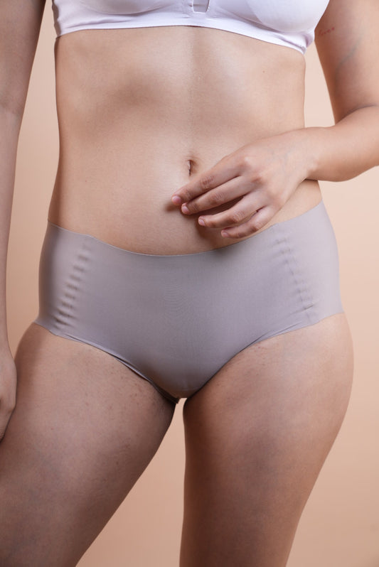 Your go to essential: LayBareShop's BareFit mid-waist panty with soft stretch fabric, cotton gusset, gentle shaping and no visible lines—designed for daily comfort.
