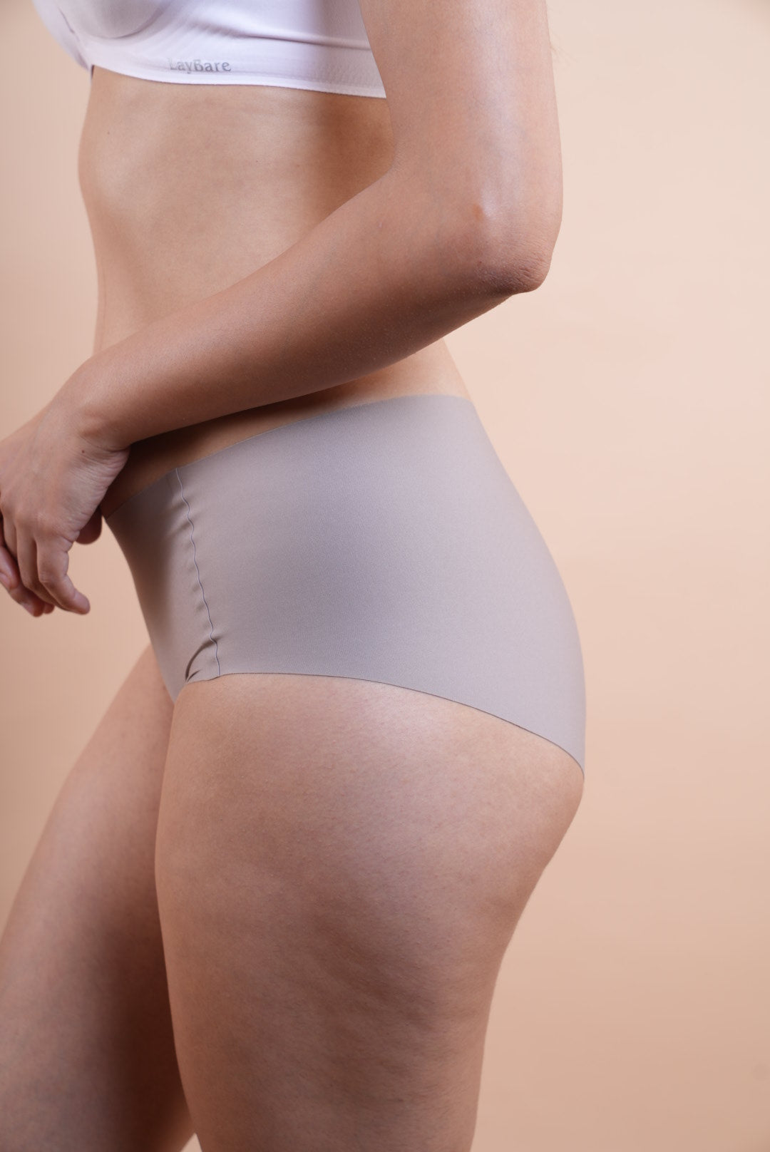 Your go to essential: LayBareShop's BareFit mid-waist panty with soft stretch fabric, cotton gusset, gentle shaping and no visible lines—designed for daily comfort.
