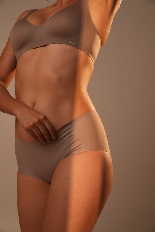 Your go to essential: LayBareShop's BareFit mid-waist panty with soft stretch fabric, cotton gusset, gentle shaping and no visible lines—designed for daily comfort.
