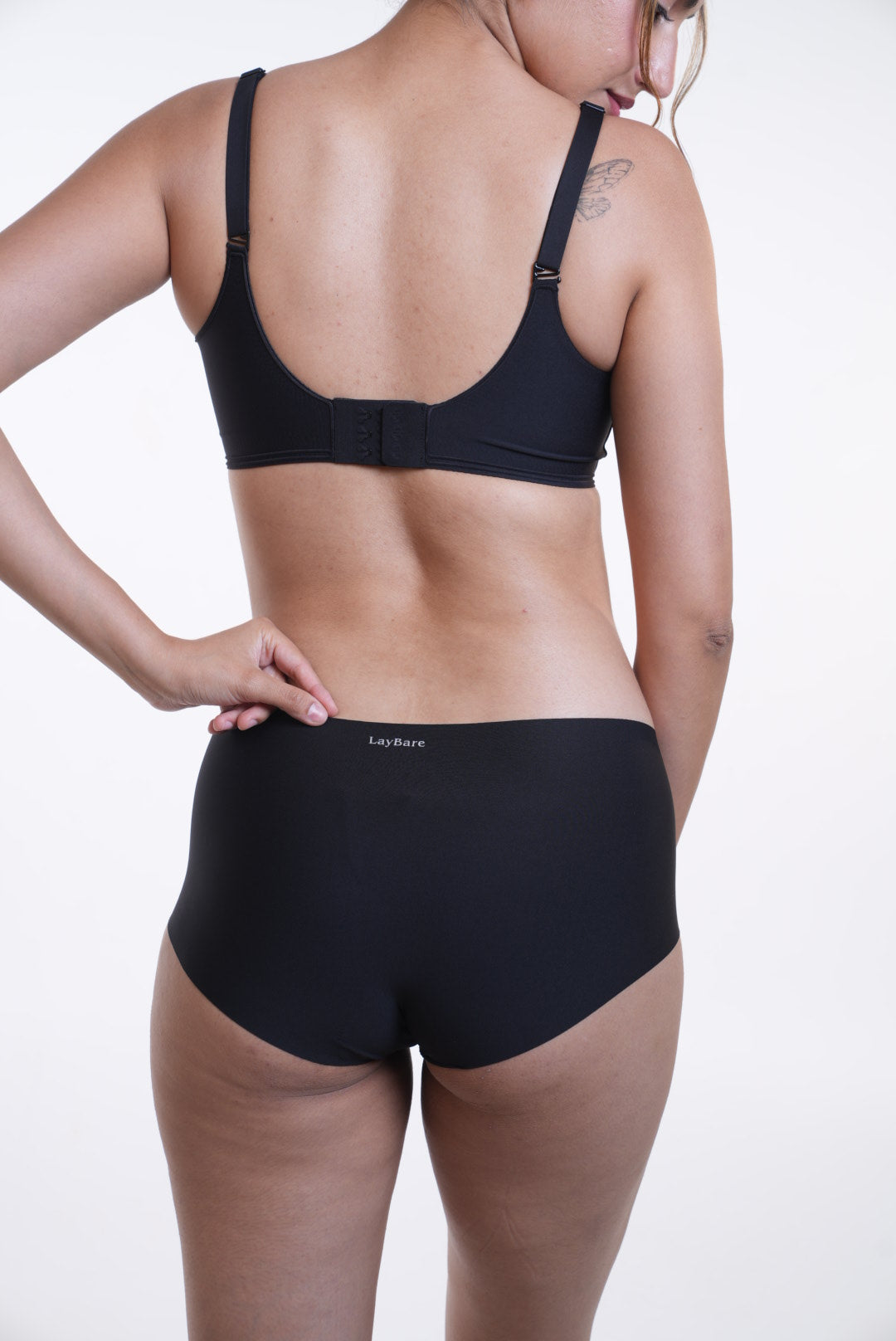 Your go to essential: LayBareShop's BareFit mid-waist panty with soft stretch fabric, cotton gusset, gentle shaping and no visible lines—designed for daily comfort.
