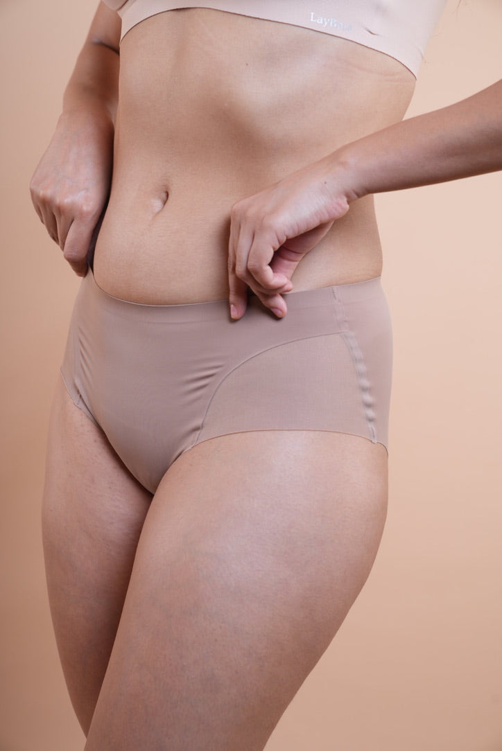 Upgrade your basics with LayBareShop Elevess—mid-waist, light shaping panty with mesh detail, cotton gusset, and a smooth, invisible finish for everyday confidence.