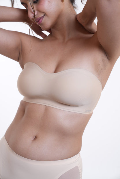 LayBareShop SnugHug strapless bra: seam-free, wireless support with natural lift and all day comfort. Perfect fit for off-shoulder looks and confident, carefree movement.