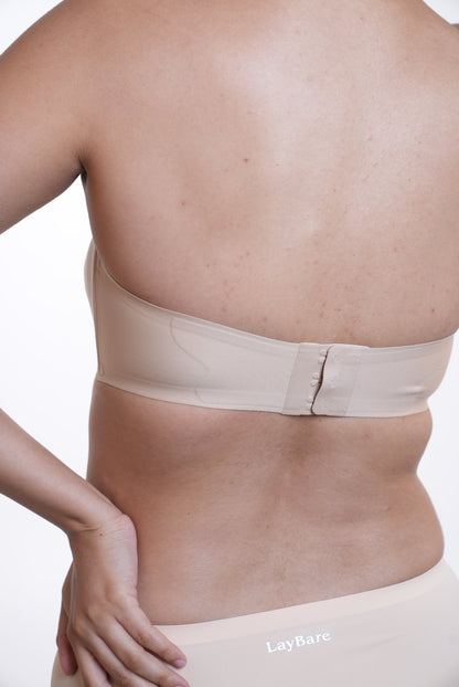 LayBareShop SnugHug strapless bra: seam-free, wireless support with natural lift and all day comfort. Perfect fit for off-shoulder looks and confident, carefree movement.